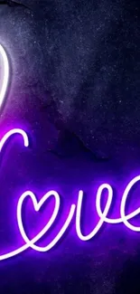 Neon love sign with purple glow and dark background.