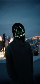 Hooded figure in a neon mask with a city backdrop.