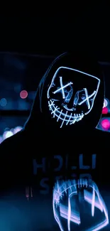 Hooded figure wearing a neon mask in a dark urban environment.