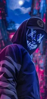 Neon masked figure in urban setting wallpaper.