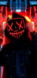 Neon masked figure in red and black hues.