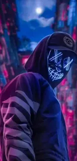 Hooded figure with neon mask in a vibrant urban setting.