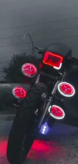 Motorcycle with neon red lights in a nightscape setting.