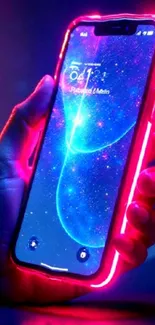 Neon-lit phone with galaxy themed wallpaper.