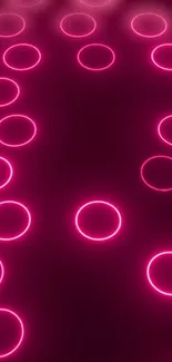 Neon pink circle pattern on dark background.