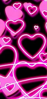 Vibrant neon pink hearts on a dark background.