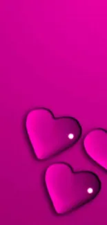 Three neon pink heart shapes on a vibrant pink background.