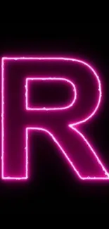 Neon pink letter R glowing against a dark background.