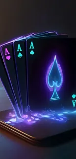 Neon glowing aces on a smartphone.