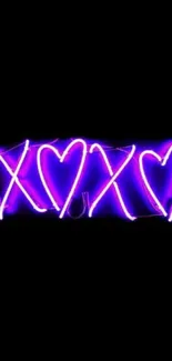 Neon purple XOXO heart design on black background wallpaper.