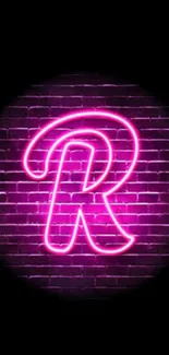 Neon letter R on a purple brick wall wallpaper.