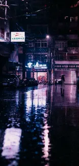 Neon-lit rainy street reflecting vibrant colors at night.