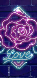 Vibrant neon rose with love text against a brick wall background.