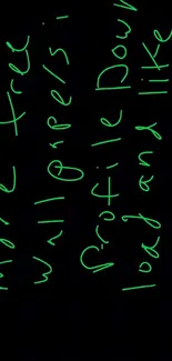 Neon green scribbles on a black mobile wallpaper.