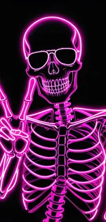 Neon pink skeleton showing peace sign in vibrant style.