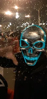 Neon skull mask with golden sparkles in nighttime urban setting.