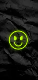 Neon smiley face on grunge black background.