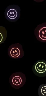 Colorful neon smiley faces on black wallpaper.