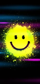 Vibrant neon smiley face with paint splatter on dark background.