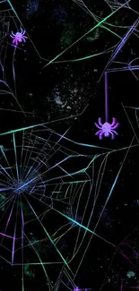 Neon spider web on dark cosmic backdrop.