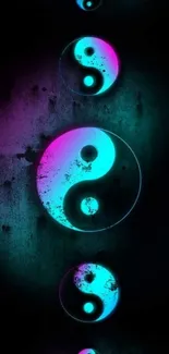 Neon yin yang symbol with pink and cyan glow on a dark backdrop.