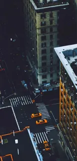 Aerial view of New York City with yellow taxis on streets.