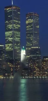 New York City skyline at night with Twin Towers.