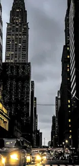 New York City nightscape with towering skyscrapers and streetlights.