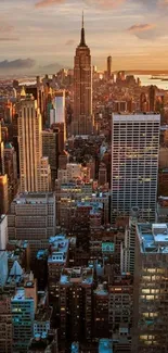 New York City skyline at sunset with illuminated buildings and a vibrant sky.