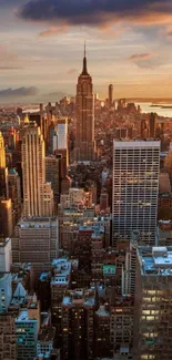 New York skyline at sunset with skyscrapers and vibrant sky.