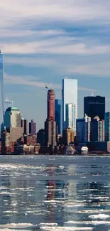 New York skyline with icy water reflections.