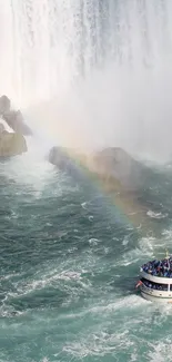 Boat near a vibrant rainbow at Niagara Falls.