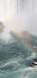 Boat cruising near Niagara Falls with a vibrant rainbow arching over the water.