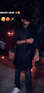 A man in traditional attire at a nighttime celebration with lanterns.