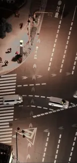 Aerial view of a bustling city intersection at night with vivid streetlines.