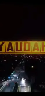 Night cityscape with bold YAUDAH text and illuminated street.