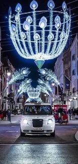 City street illuminated by chandeliers at night.