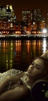 Elegant woman with city night skyline in the background.