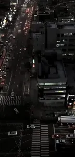 Night city view with busy traffic on illuminated roads.