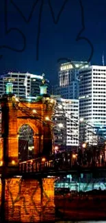 Illuminated bridge and skyline at night wallpaper.