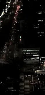 Night view of a busy city street with cars and lights.