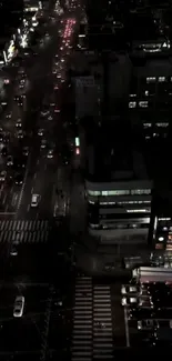 Overhead view of a bustling city street at night.