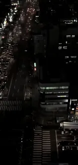 Nighttime city street view with traffic and lights.