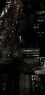 Aerial view of vibrant city traffic at night with street lights.