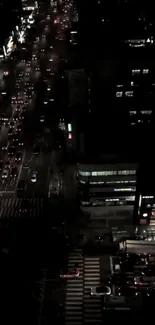 Night city scene with busy traffic and illuminated street lights.