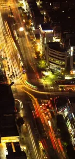 Dynamic night city traffic wallpaper with glowing light trails.