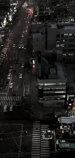 Aerial night view of a vibrant cityscape with brightly lit streets.