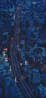 Aerial view of a city at night showcasing vibrant urban lights.