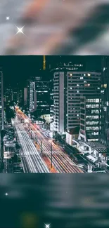 Night cityscape wallpaper with vibrant urban lights and dark sky.