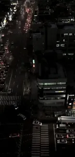 Night cityscape with glowing street lights and busy traffic.